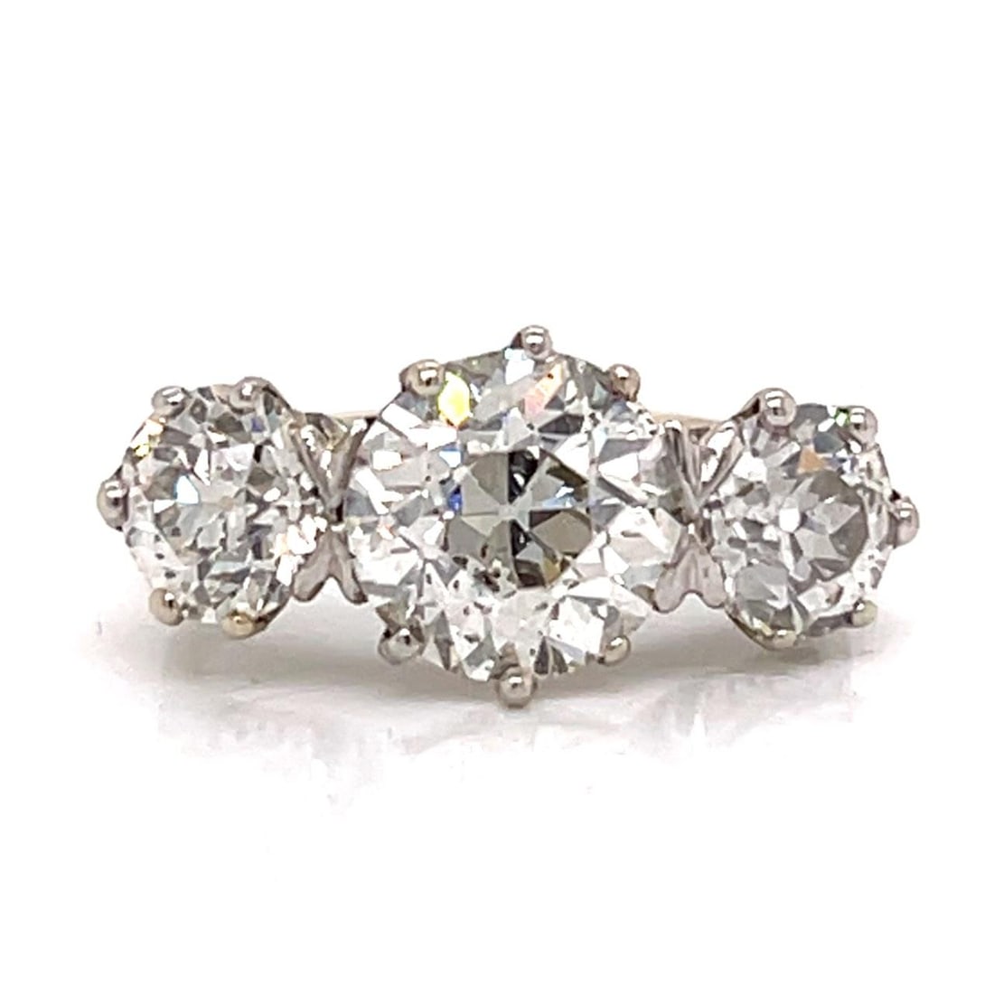 Platinum Art Deco Ring with 4.15 Carat Three European Cut Diamonds: Platinum Art Deco Ring with 4.15 Carat Three European Cut Diamonds This Art Deco platinum ring features a three-stone design set with a central approximately 2.45 ct. European-cut diamond, flanked by 