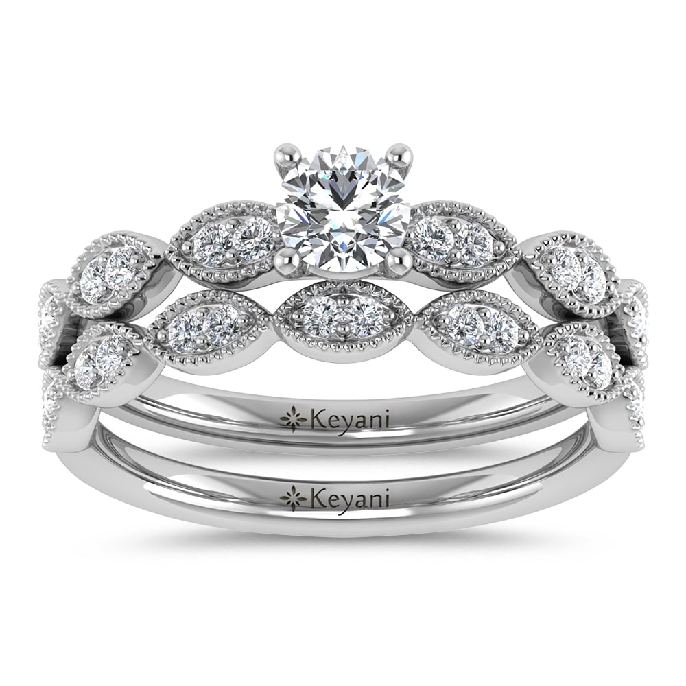 Diamond 1/2 Ct.Tw. Round Cut Bridal Ring in 14K White Gold: Diamond 1/2 Ct.Tw. Round Cut Bridal Ring in 14K White Gold 14k White Gold Stone Color: G-h Stone Clarity: Si2 Each ring is presented in standard size 6.5. Complimentary resizing is available between s