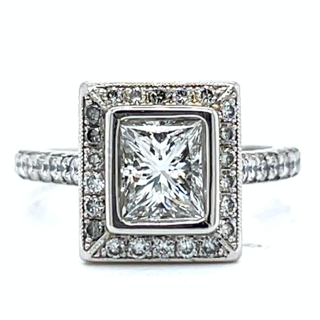 Platinum 2.69 Ct. Diamond Ring with 1.38 Ct. Center Stone: Platinum 2.69 Ct. Diamond Ring with 1.38 Ct. Center Stone This exquisite platinum ring features a stunning 1.38 Ct. Rectangular Modified Brilliant Diamond, graded H color and VVS clarity. The ring is 