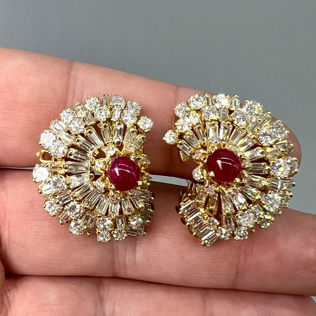 Platinum and 18K Gold Earrings with Rubies and Diamonds from the 1960s: Platinum and 18K Gold Earrings with Rubies and Diamonds from the 1960s Elegant earrings from the 1960s crafted in platinum and 18K yellow gold, featuring two rubies with a total approximate weight of 