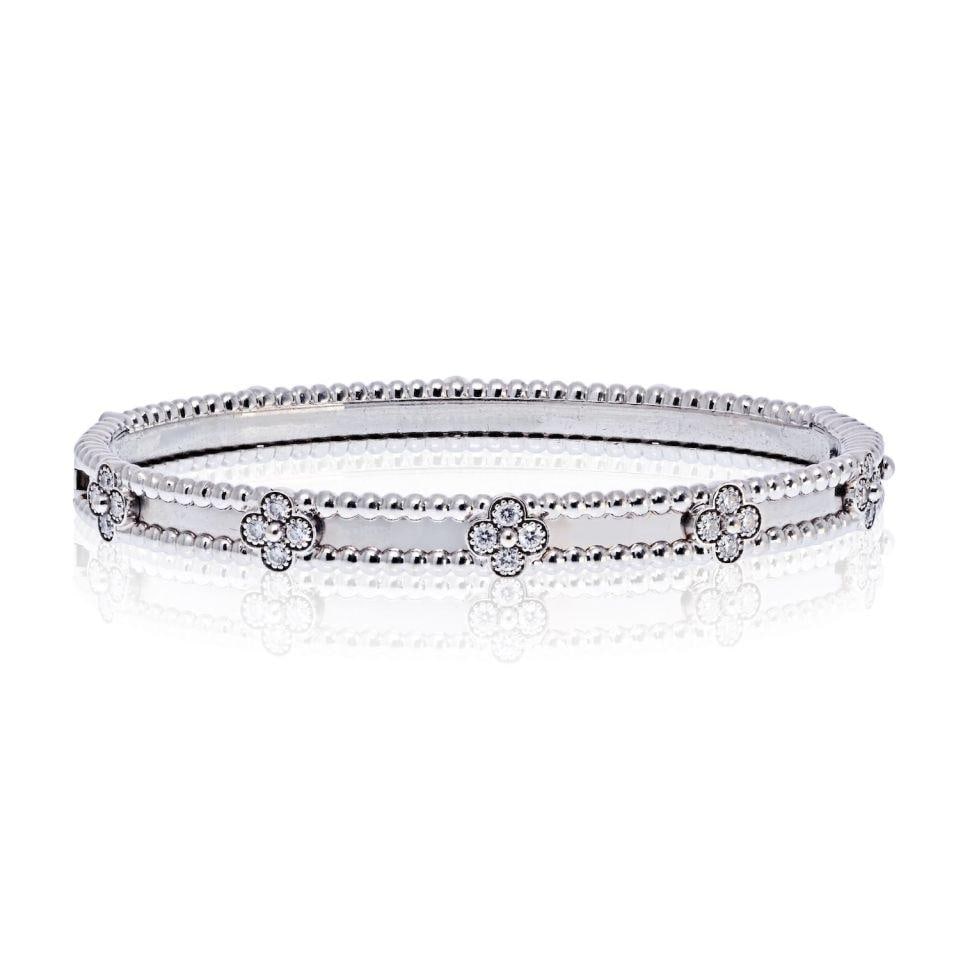 Van Cleef & Arpels 18K White Gold Perlee Clover Diamond Bracelet: Van Cleef & Arpels 18K White Gold Perlee Clover Diamond Bracelet This exquisite Van Cleef & Arpels Perlee Clover bracelet showcases a delicate clover motif, elegantly crafted in 18K white gold. The br
