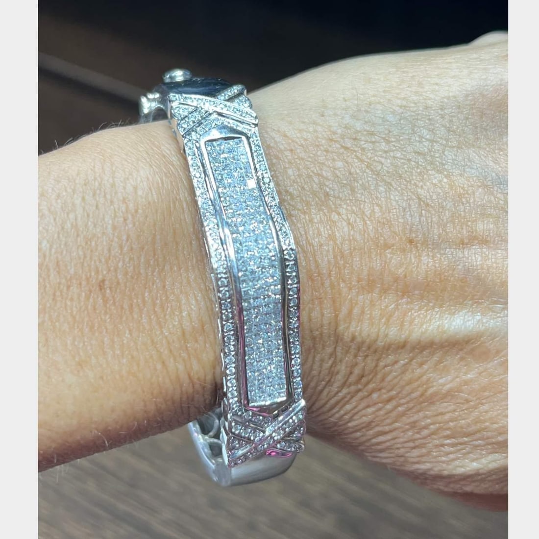 14K White Gold Bangle with 8.00 Ct Diamonds E-G Color VS1-SI1: 14K White Gold Bangle with 8.00 Ct Diamonds E-G Color VS1-SI1 This exquisite 14K white gold bangle showcases approximately 8.00 carats of dazzling princess-cut and round diamonds. The diamonds are gra