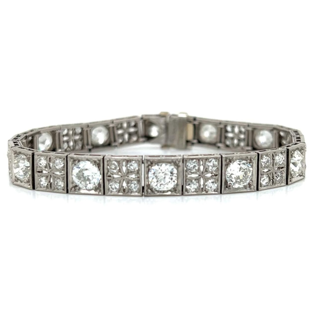 Art Deco Platinum Diamond Bracelet 9.20 Ct Vintage Elegance: Art Deco Platinum Diamond Bracelet 9.20 Ct Vintage Elegance This exquisite Art Deco bracelet is crafted in platinum and features a stunning total diamond weight of 9.20 carats. It is adorned with 12 E