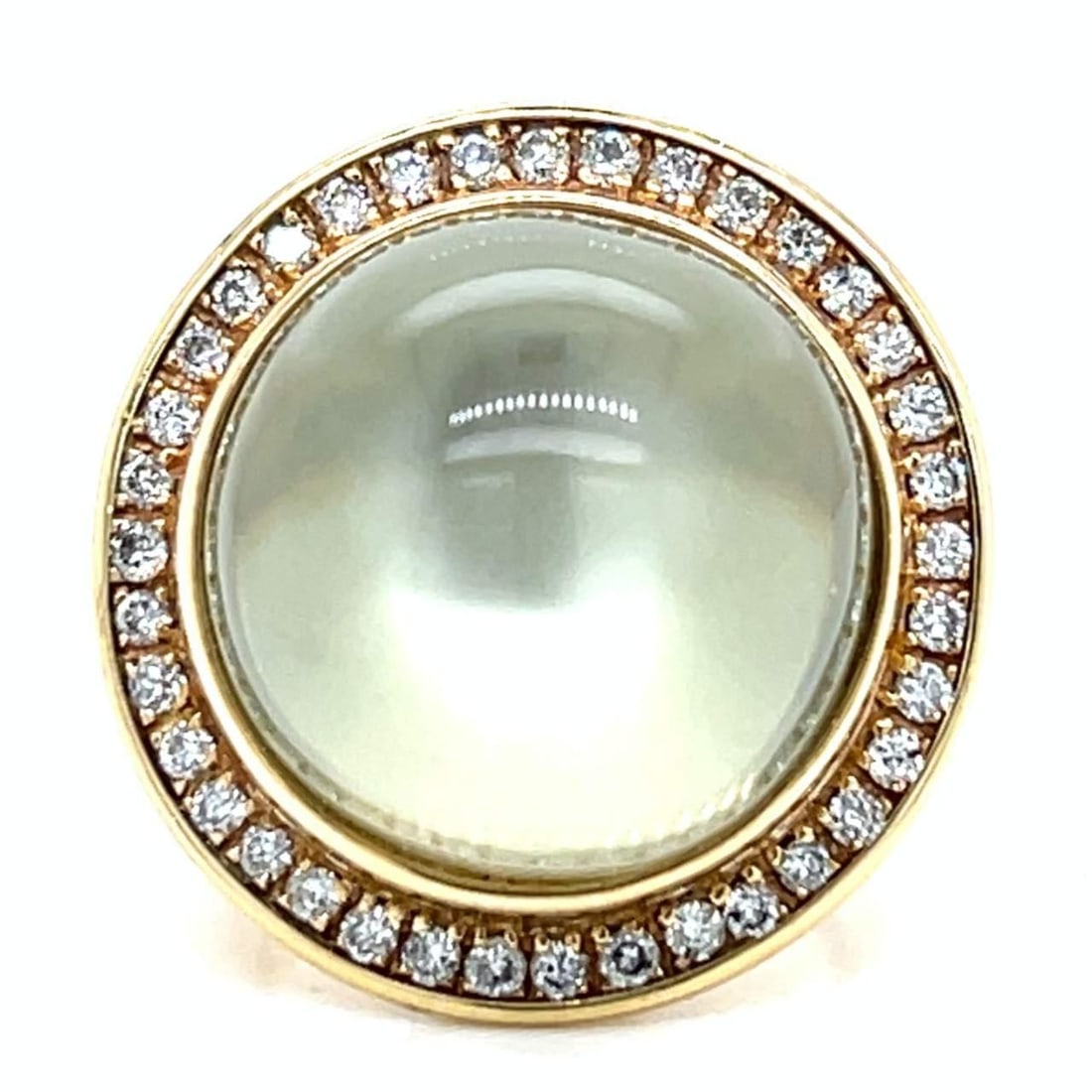 14K Yellow Gold Moonstone 28.50 Ct Diamond Ring: 14K Yellow Gold Moonstone 28.50 Ct Diamond Ring This exquisite 14K Yellow Gold Moonstone and Diamond Ring features a stunning centerpiece of approximately 28.50 carats of moonstone, gracefully complem
