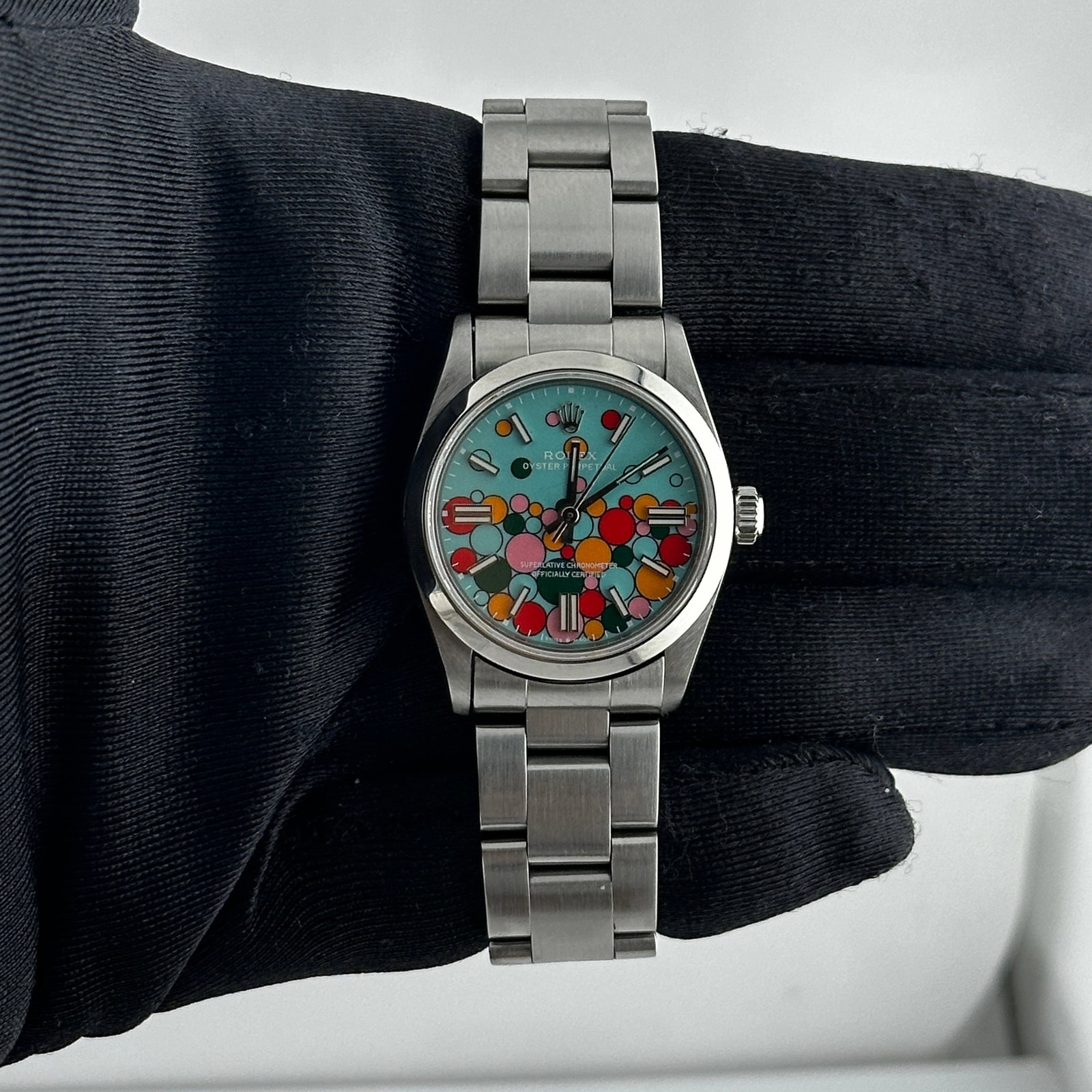 Ladies Rolex Oyster Perpetual Ref 67480 Celebration Dial with Oyster Bracelet: Ladies Rolex Oyster Perpetual Ref 67480 Celebration Dial with Oyster Bracelet This Rolex Oyster Perpetual features an Aftermarket Celebration dial and is designed for ladies. The watch includes a smoo
