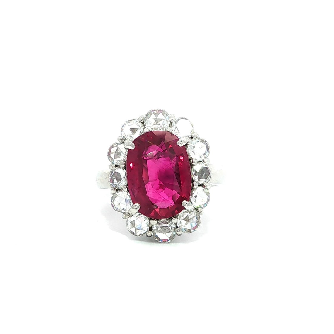 GIA Certified 6.37ctw Oval Ruby Platinum Ring with Rose Cut Diamonds: GIA Certified 6.37ctw Oval Ruby Platinum Ring with Rose Cut Diamonds This exquisite cocktail ring features a stunning natural oval ruby, weighing 4.93 carats, set in solid platinum. The ruby showcases