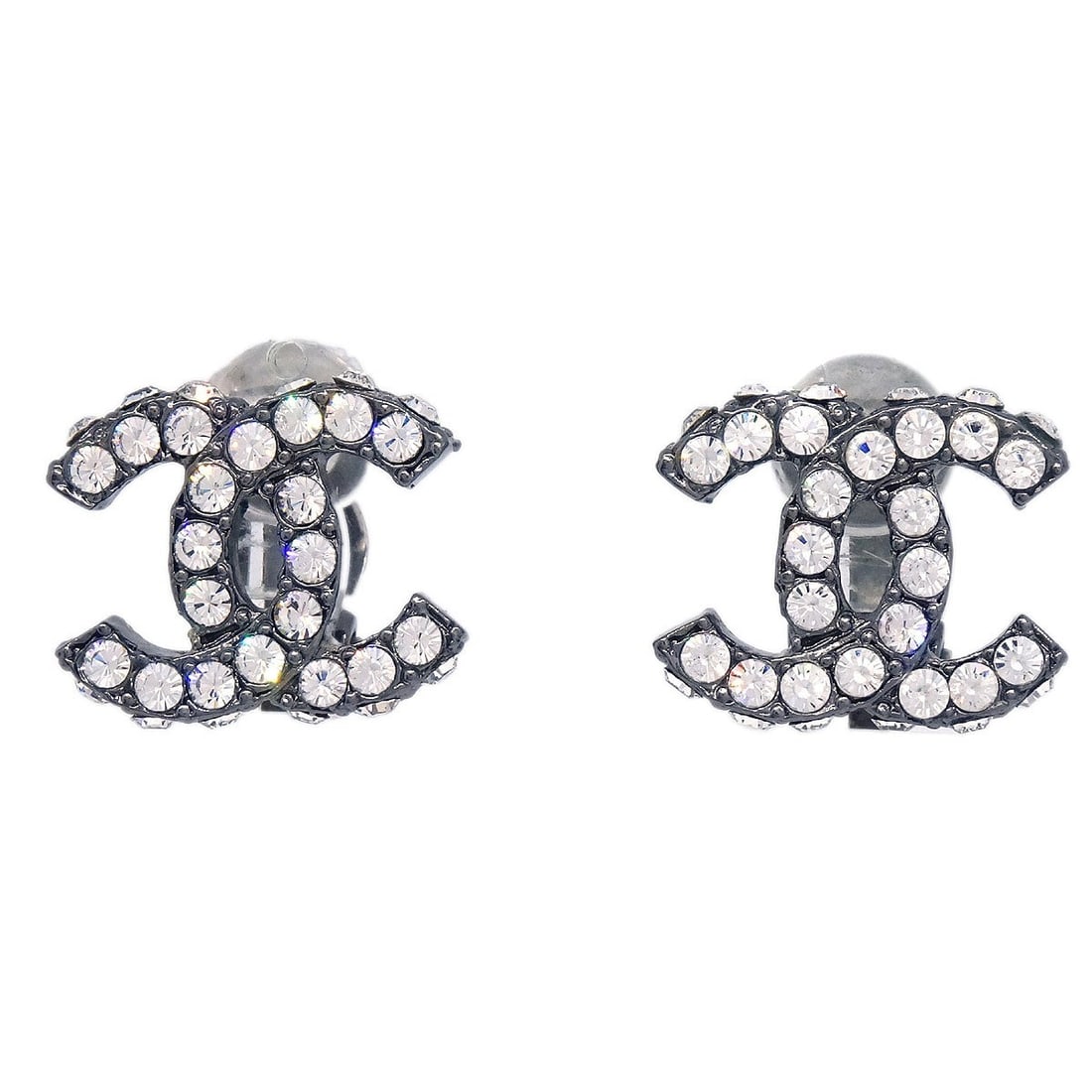 Chanel Clip-On CC Logo Silver Plated Rhinestone Earrings 03A: Chanel Clip-On CC Logo Silver Plated Rhinestone Earrings 03A These Chanel CC clip-on earrings feature a signature logo design adorned with rhinestones. Crafted from silver-plated metal, they showcase 