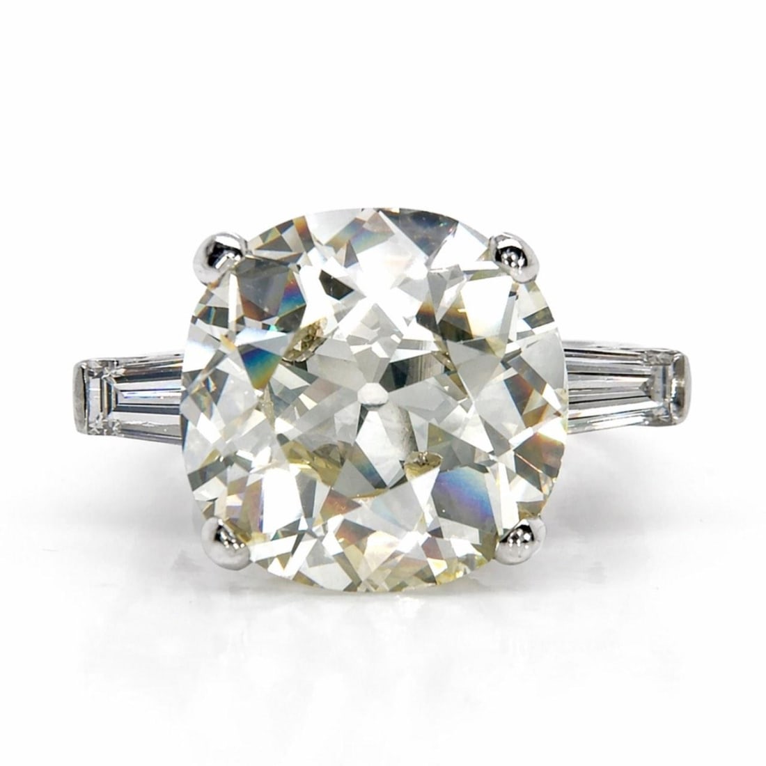 Platinum Art Deco Diamond Ring with 7.51 Carat Cushion Cut Center: Platinum Art Deco Diamond Ring with 7.51 Carat Cushion Cut Center This Art Deco platinum ring features a 7.51 carat old cushion-cut diamond with O-P color and VVS1 clarity. Accentuating the center sto