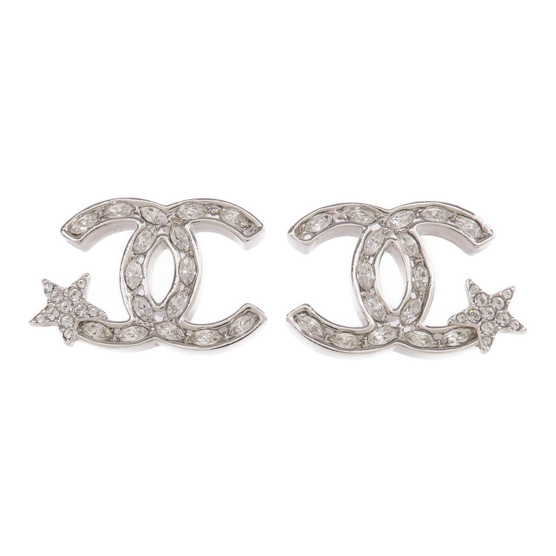 Silver Tone Pierced Earrings by CHANEL with CC Logo: Silver Tone Pierced Earrings by CHANEL with CC Logo These CHANEL CC pierced earrings feature a silver-tone finish and the iconic CC logo design. Crafted in France, they offer a sleek and timeless acce