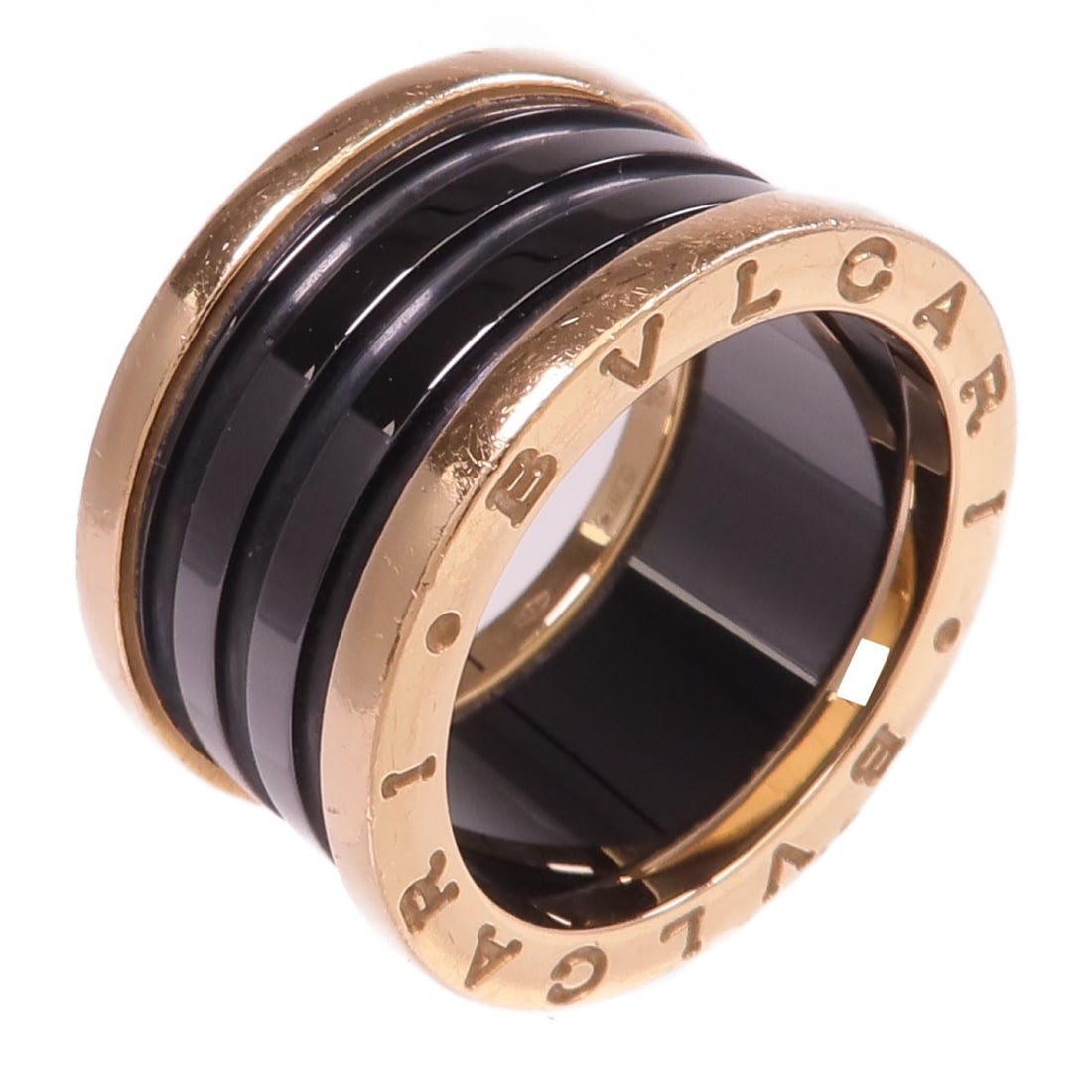 B.zero1 18K Rose Gold and Black Ceramic Ring by BVLGARI Size 6.5: B.zero1 18K Rose Gold and Black Ceramic Ring by BVLGARI Size 6.5 This BVLGARI B.zero1 ring features 18K rose gold and black ceramic accents. The ring is a size 6.5 US and is designed without a main st