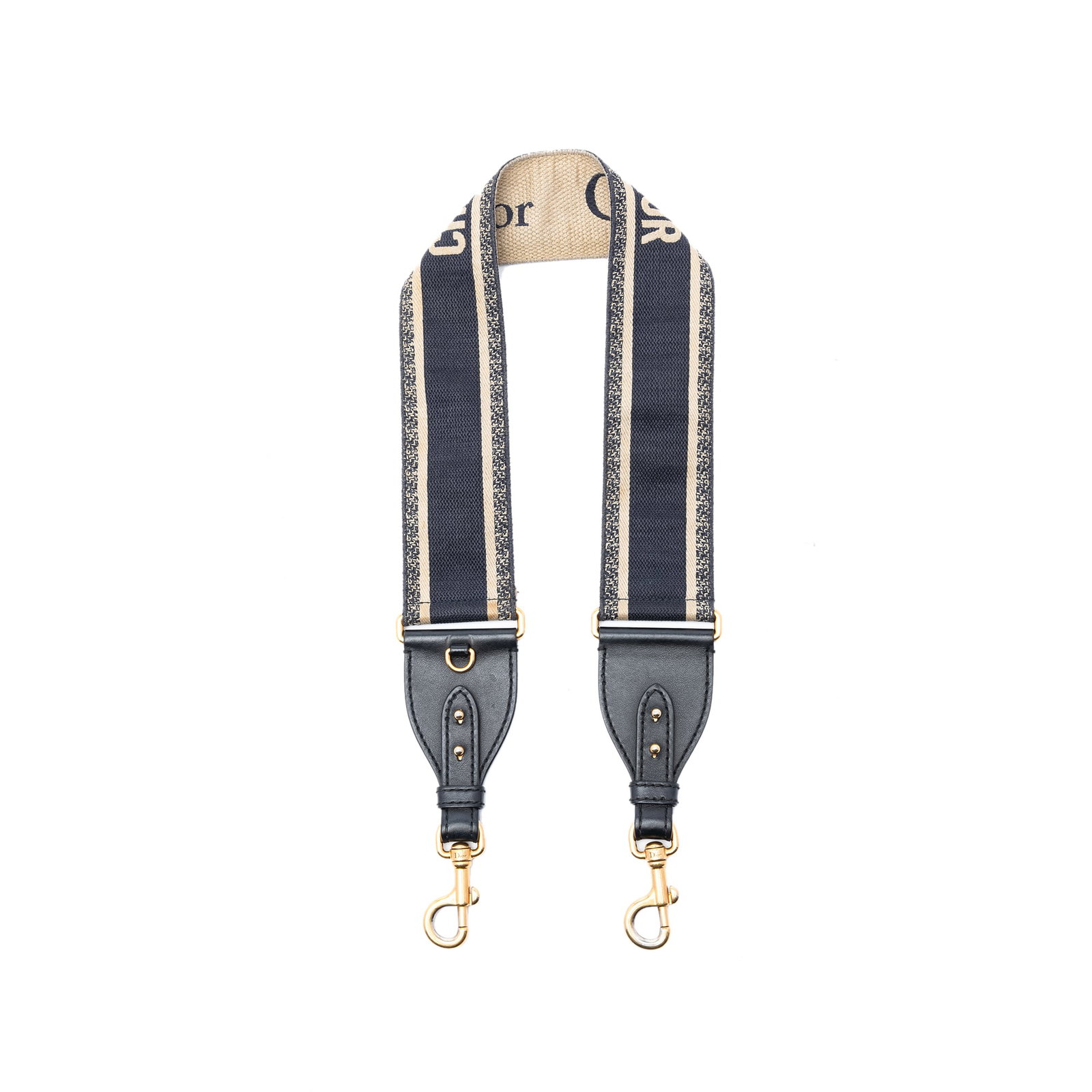 Blue Embroidered Canvas Strap with Leather Trim and Gold Tone Hardware by Dior: Blue Embroidered Canvas Strap with Leather Trim and Gold Tone Hardware by Dior This Dior embroidered canvas bag strap features a blue fabric body with leather trim and gold-tone hardware. Made in Ital