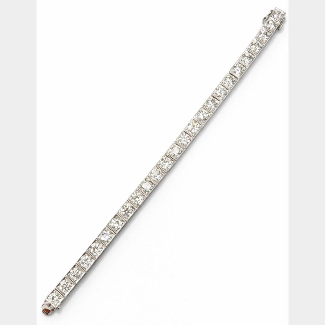 Diamond Tennis Bracelet 14.10 Carat 18K White Gold Platinum 6.75 Inch: Diamond Tennis Bracelet 14.10 Carat 18K White Gold Platinum 6.75 Inch This 14.10 carat diamond tennis bracelet is crafted from 18K white gold and platinum. It features 26 European-cut diamonds with a 