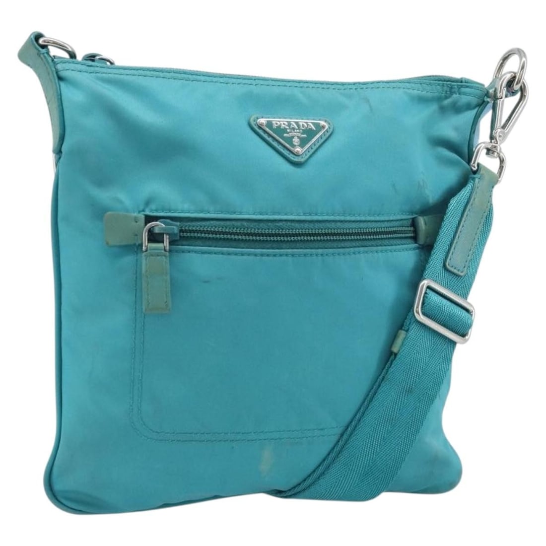 Prada nylon light blue silver shoulder bag Italy: Prada nylon light blue silver shoulder bag Italy This PRADA shoulder bag is crafted from light blue nylon with silver-tone accents. Designed for women, it features a spacious main compartment and an a