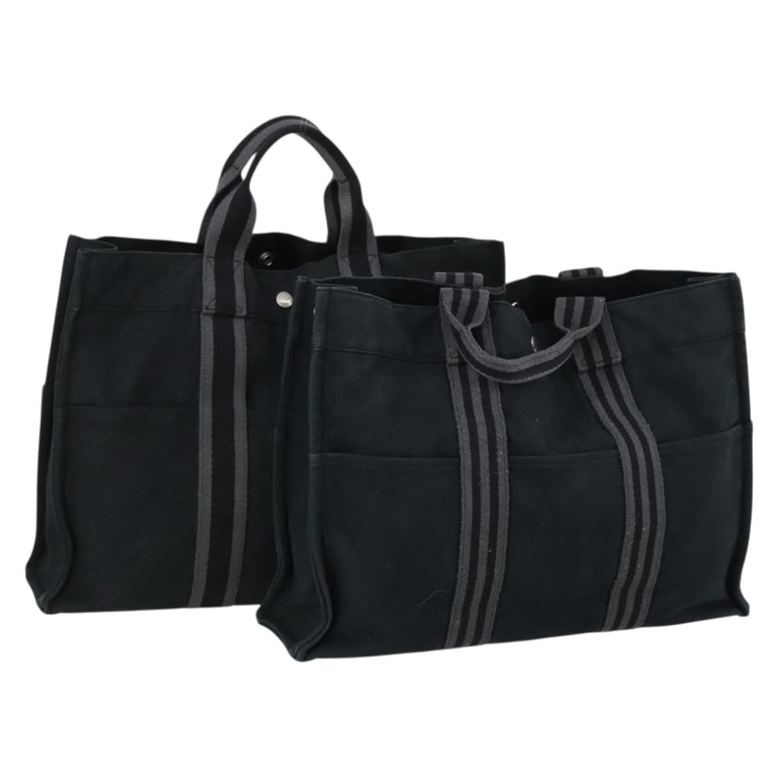 Set of 2 Hermes Fourre Tout MM Black Canvas Handbags: Set of 2 Hermes Fourre Tout MM Black Canvas Handbags This Hermes Fourre Tout MM handbag set features two black canvas bags, crafted in France. The bags have a structured design with ample capacity, an