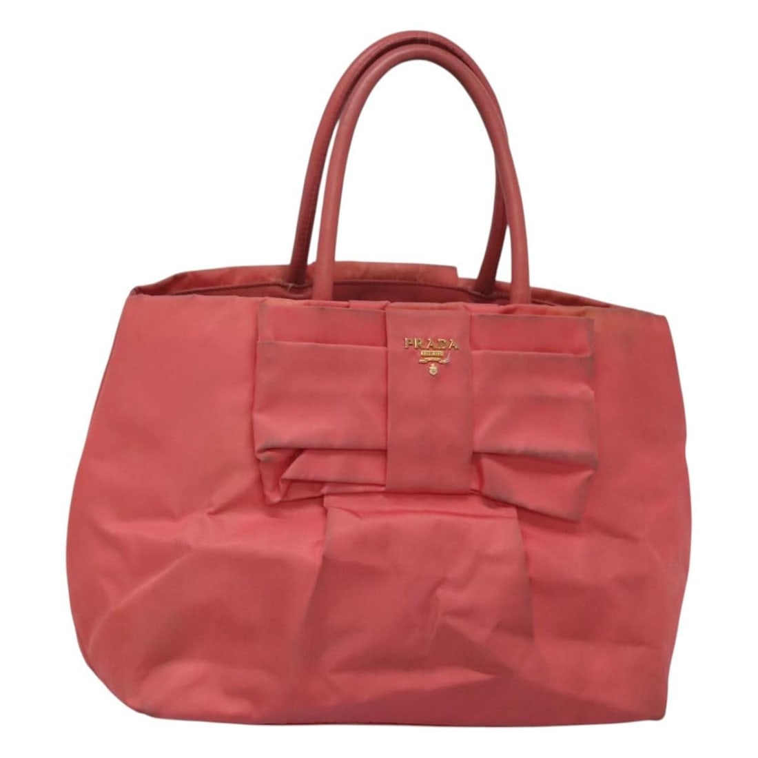 Prada pink gold nylon tote bag Italy 11 inch: Prada pink gold nylon tote bag Italy 11 inch This PRADA tote bag is crafted from nylon in pink and gold tones. Made in Italy, it features dual top handles and a spacious interior. The bag shows notabl