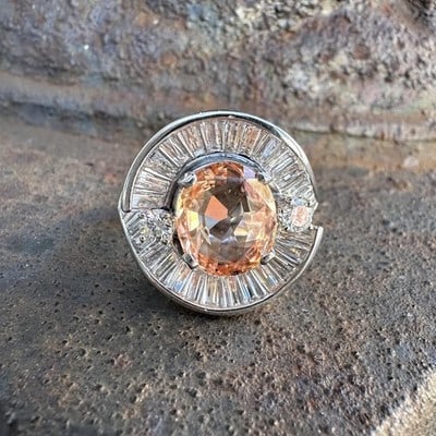 GIA Certified No Heat Padparadscha Sapphire and Diamond Platinum Cocktail Ring: GIA Certified No Heat Padparadscha Sapphire and Diamond Platinum Cocktail Ring This vintage cocktail ring features a certified 3.83 carat natural Padparadscha sapphire from Sri Lanka, displaying a pin