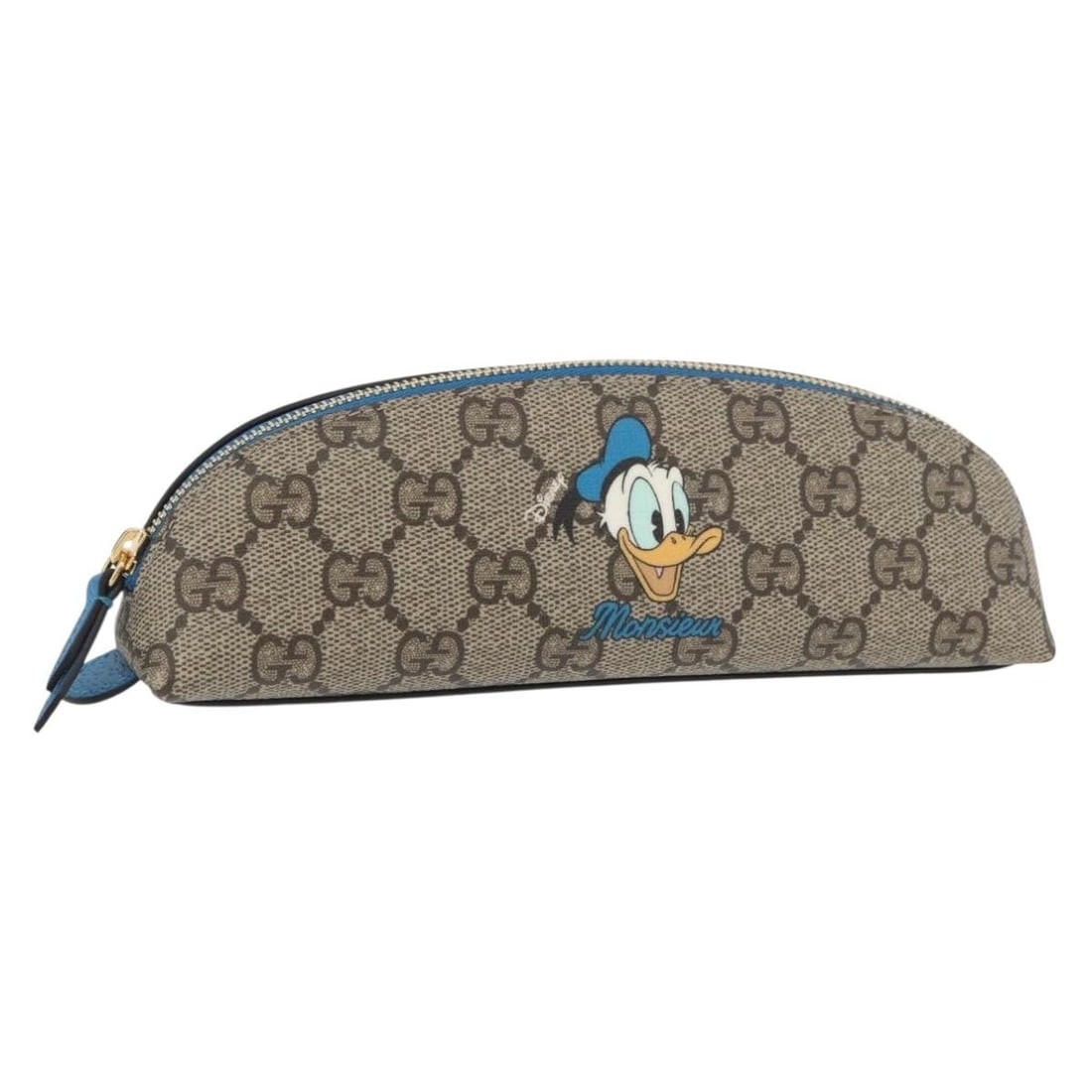 Disney Donald Duck GG Supreme Beige Gold Pen Case by Gucci in PVC: Disney Donald Duck GG Supreme Beige Gold Pen Case by Gucci in PVC This GUCCI x Disney GG Supreme Donald Pen Case features a collaboration design crafted from beige and gold PVC leather with GG canvas 