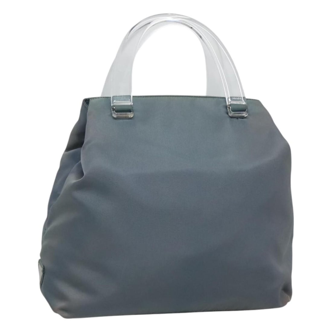 Light Blue Nylon PRADA Handbag With Silver and Clear Accents: Light Blue Nylon PRADA Handbag With Silver and Clear Accents This authentic PRADA handbag features a stylish combination of light blue, silver, and clear nylon with plastic accents. Designed for women