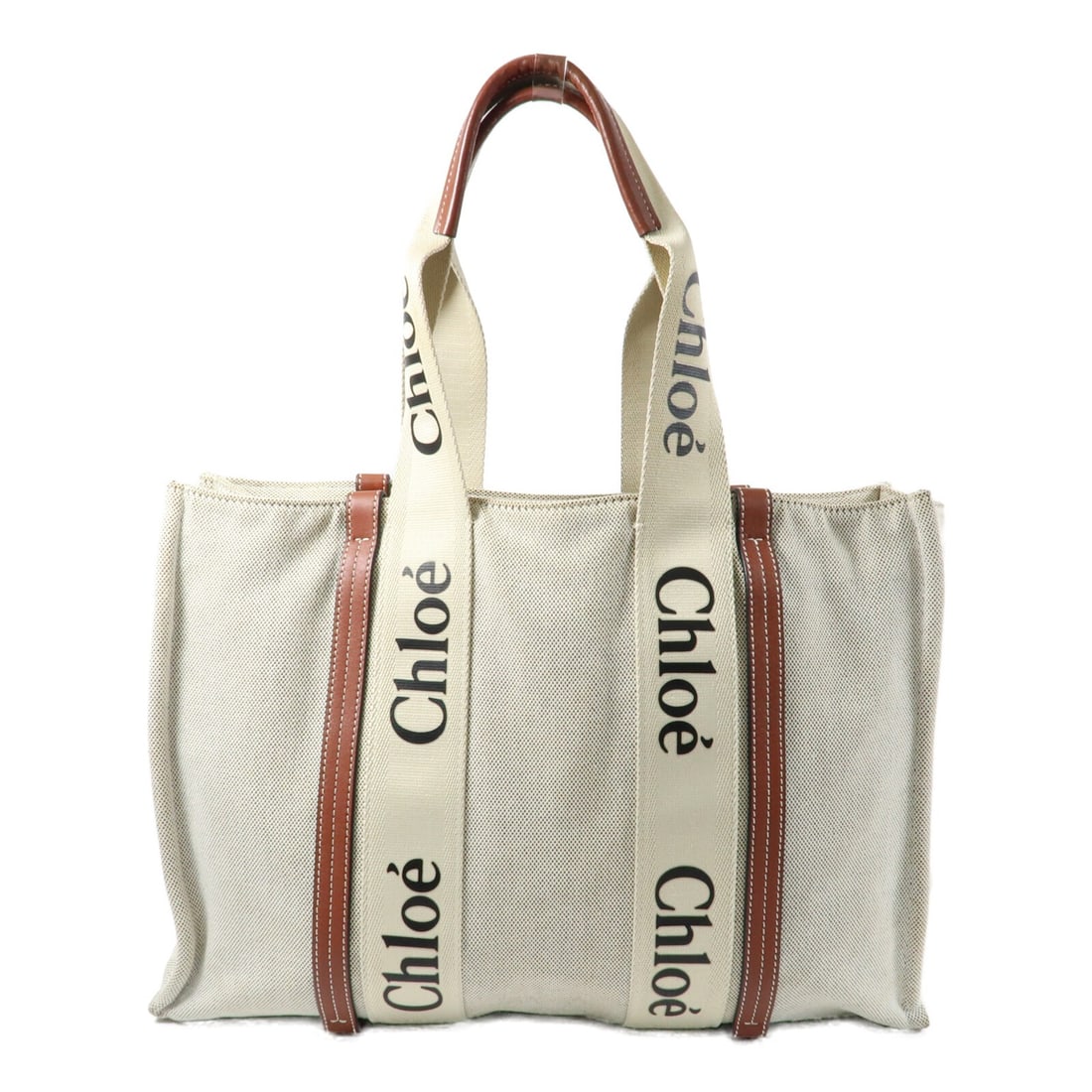 Chloe Woody Beige Canvas Tote for Women 16.1 Inch: Chloe Woody Beige Canvas Tote for Women 16.1 Inch This Chloe tote bag features a beige canvas exterior, offering a blend of style and functionality. Designed for women, the bag is made in France and s
