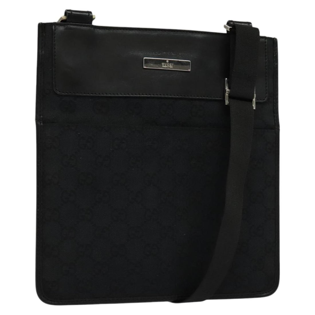 Black GG Canvas Shoulder Bag by Gucci 019 0348 Italy: Black GG Canvas Shoulder Bag by Gucci 019 0348 Italy This is a Gucci GG Canvas shoulder bag in black, designed for women. Crafted in Italy, it features the signature GG canvas exterior and a practical