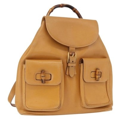 Gucci Bamboo leather backpack brown gold Italy 003 2058 0016: Gucci Bamboo leather backpack brown gold Italy 003 2058 0016 This is a Gucci Bamboo Backpack crafted from brown leather with gold-tone accents. The bag features a classic bamboo handle and a structure