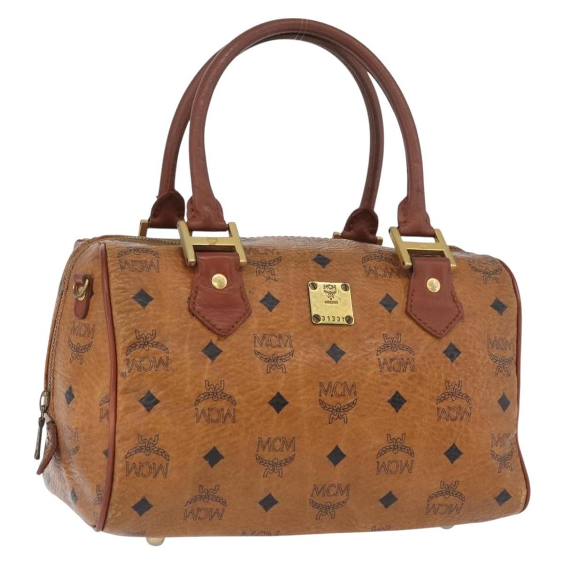 MCM Logogram Brown PVC Leather Handbag Gold Accents Germany: MCM Logogram Brown PVC Leather Handbag Gold Accents Germany This MCM hand bag features the distinctive Vicetos logogram design and is crafted from durable PVC leather in brown and gold tones. Designed