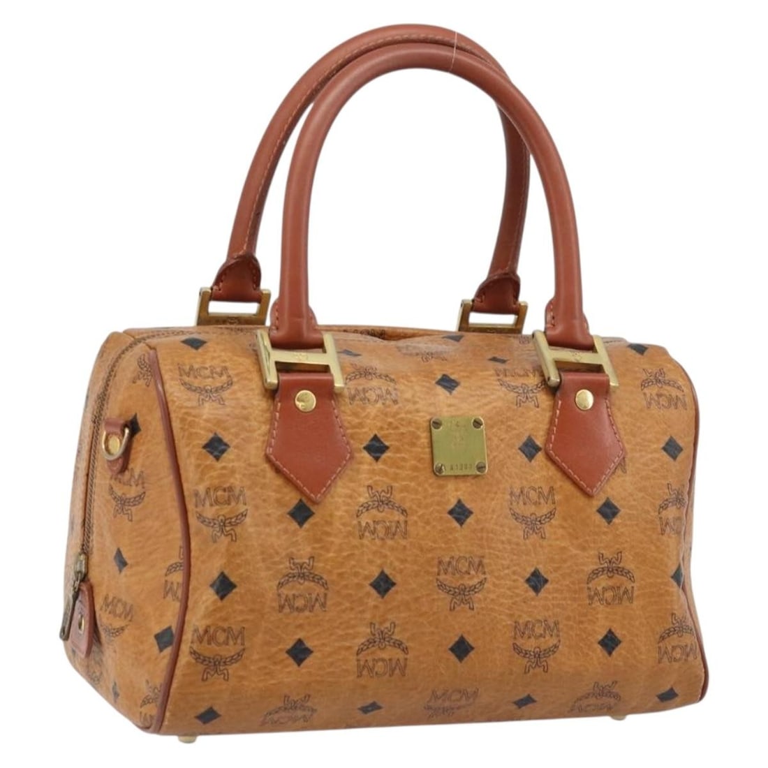 MCM Logogram Brown PVC Leather Handbag with Gold Accents: MCM Logogram Brown PVC Leather Handbag with Gold Accents This MCM Vicetos Logogram handbag is crafted from brown and gold PVC leather, featuring the classic MCM logo pattern. Designed for women, it of