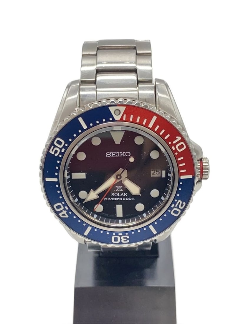 Seiko Prospex V157-0DP0 stainless steel diver wristwatch: Seiko Prospex V157-0DP0 stainless steel diver wristwatch This SEIKO Prospex Diver Scuba V157-0DP0 men's wristwatch features a stainless steel case and band in a silver tone. The watch is designed for 
