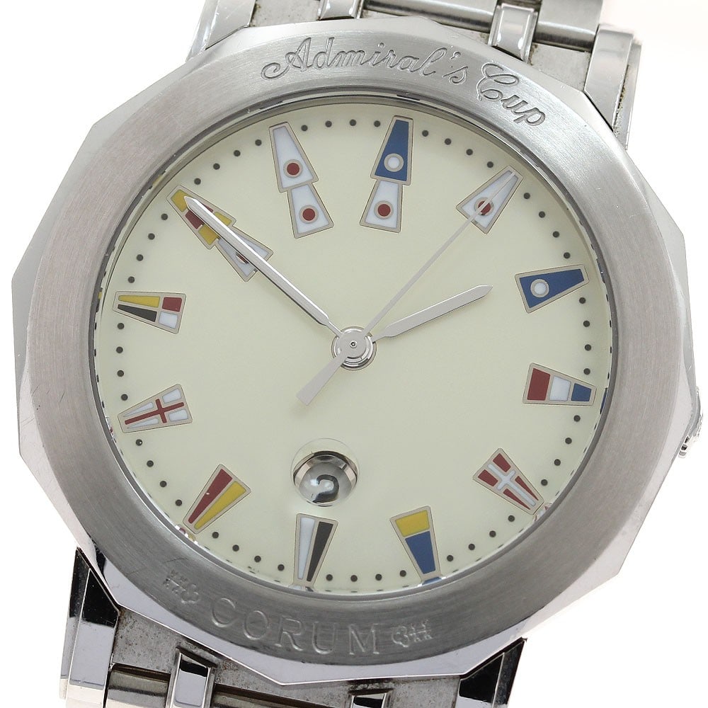 Corum Admiral's Cup quartz date men's stainless steel watch: Corum Admiral's Cup quartz date men's stainless steel watch This Corum Admiral's Cup Date Quartz men's wristwatch features a stainless steel case and bracelet with a beige dial. The watch is powered b
