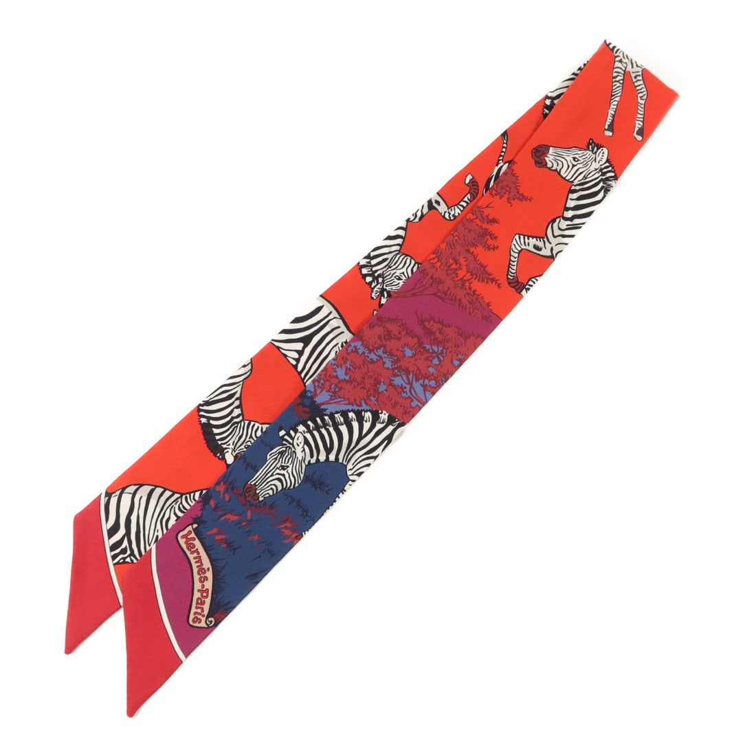 Hermes Twilly silk red women's scarf: Hermes Twilly silk red women's scarf This Hermes Twilly scarf is crafted from luxurious silk and features a vibrant red color. Designed for women, it offers a sophisticated accessory option that can b