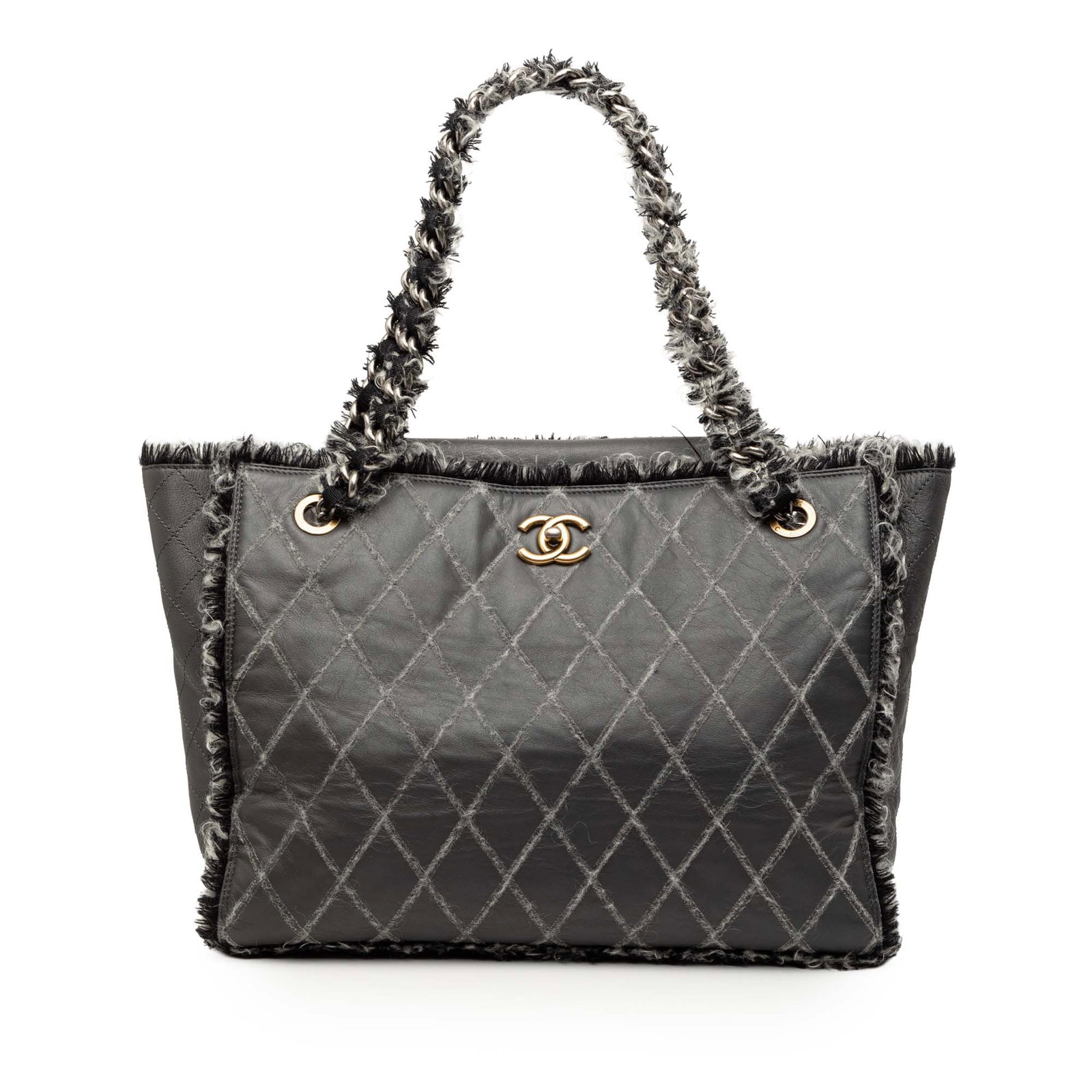 Chanel Quilted Leather Tote with Tweed Chain Straps and CC Turn Lock: Chanel Quilted Leather Tote with Tweed Chain Straps and CC Turn Lock This Chanel CC Quilted Calfskin Tweedy Shopping Tote features a leather body with tweed trim, tweed-woven chain straps, a fold-in t