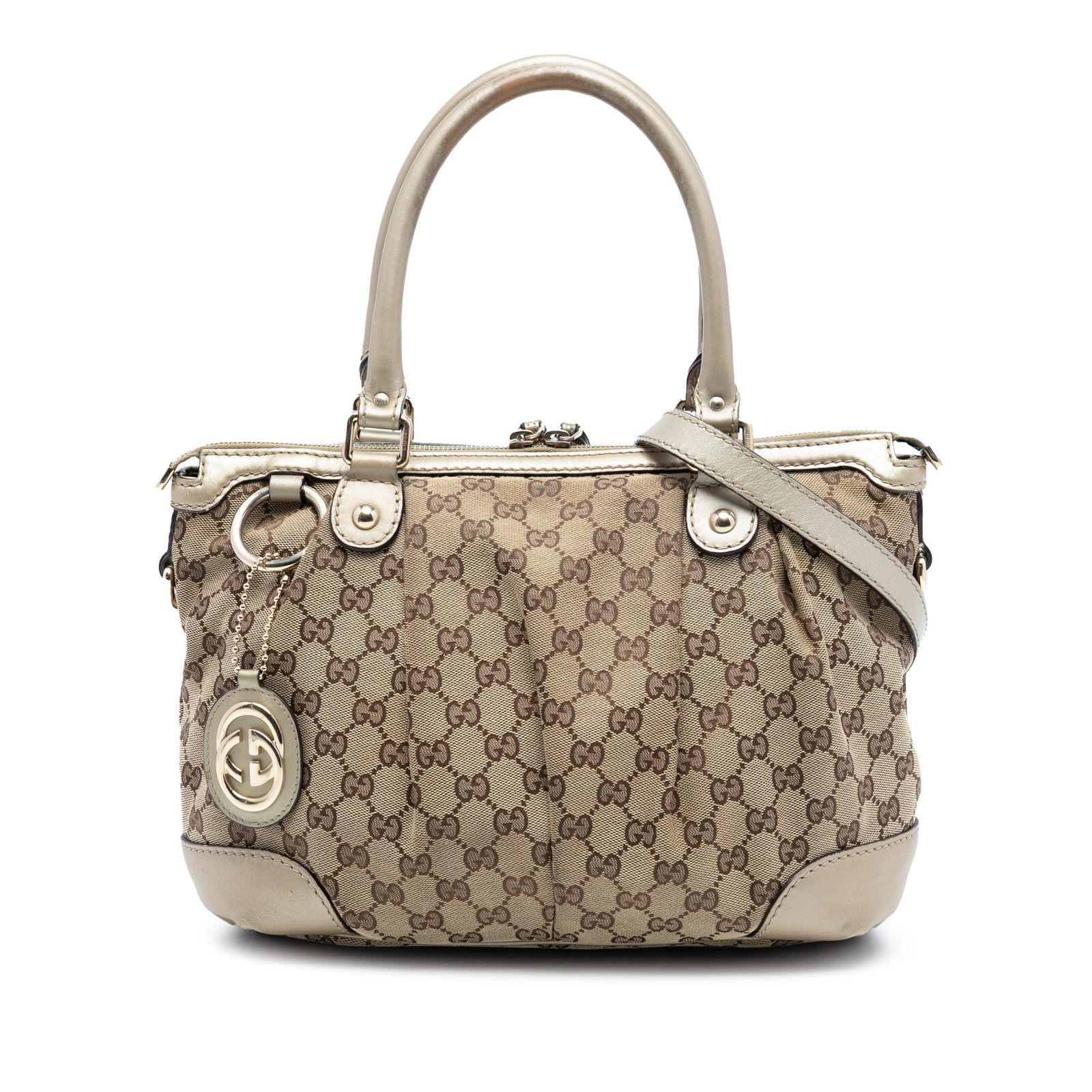 Gucci Sukey GG Canvas Brown Satchel with Leather Handles and Strap: Gucci Sukey GG Canvas Brown Satchel with Leather Handles and Strap This Gucci GG Canvas Sukey Satchel features a canvas body with rolled leather handles and a detachable, adjustable flat leather shoul