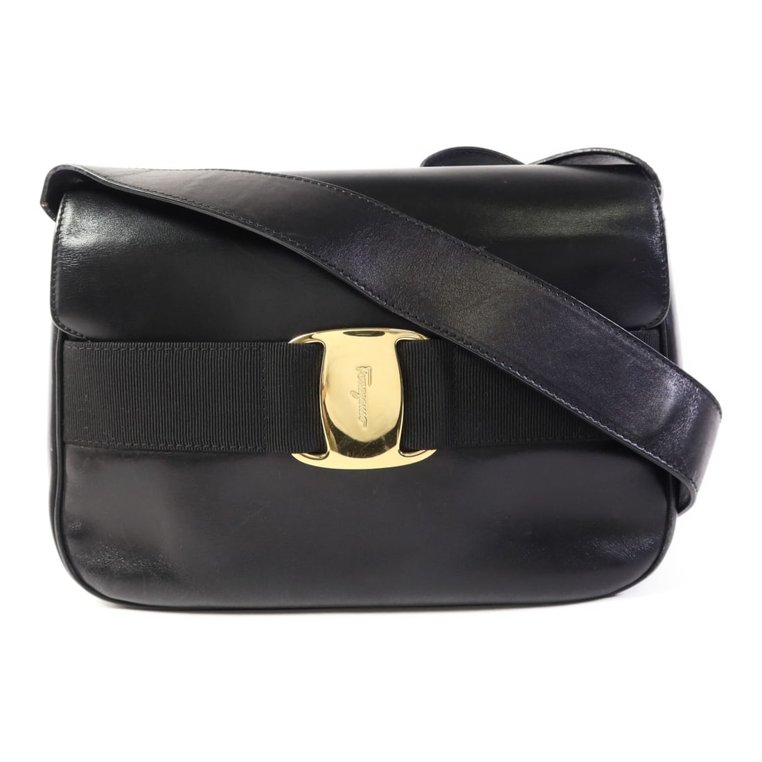 Salvatore Ferragamo Black Calfskin Shoulder Bag GHW Italy: Salvatore Ferragamo Black Calfskin Shoulder Bag GHW Italy This elegant shoulder bag by Salvatore Ferragamo is crafted from luxurious black calfskin leather, showcasing a timeless design perfect for an