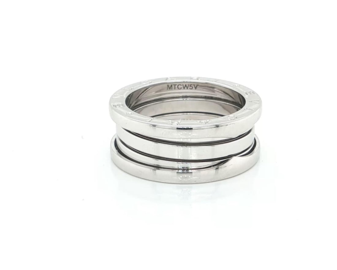 Bvlgari B.zero1 18k White Gold Spiral Ring Size 7.5 With Box And Cert: Bvlgari B.zero1 18k White Gold Spiral Ring Size 7.5 With Box And Cert This Bvlgari B.zero1 three-band ring is crafted from 18k white gold and features the brand's iconic spiral design. The ring has a 