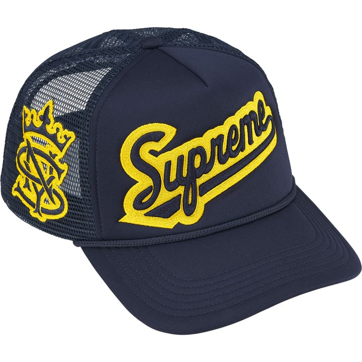 Navy Supreme University Trucker Cap with Mesh Back and Embroidered Logo: Navy Supreme University Trucker Cap with Mesh Back and Embroidered Logo This Supreme University Mesh Back 5-Panel Trucker Hat features a deep navy front panel with University embroidery, complemented 