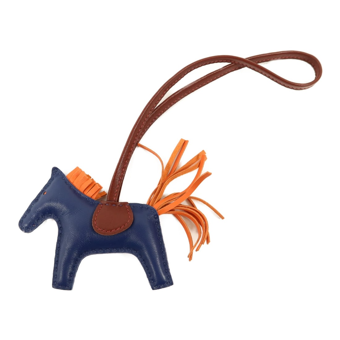 Hermes Rodeo PM Milo Leather Charm Navy Orange: Hermes Rodeo PM Milo Leather Charm Navy Orange This Hermes Rodeo PM Charm is crafted from premium Milo lambskin leather in a striking combination of Rouge H, navy, and orange. Made in France, this ele