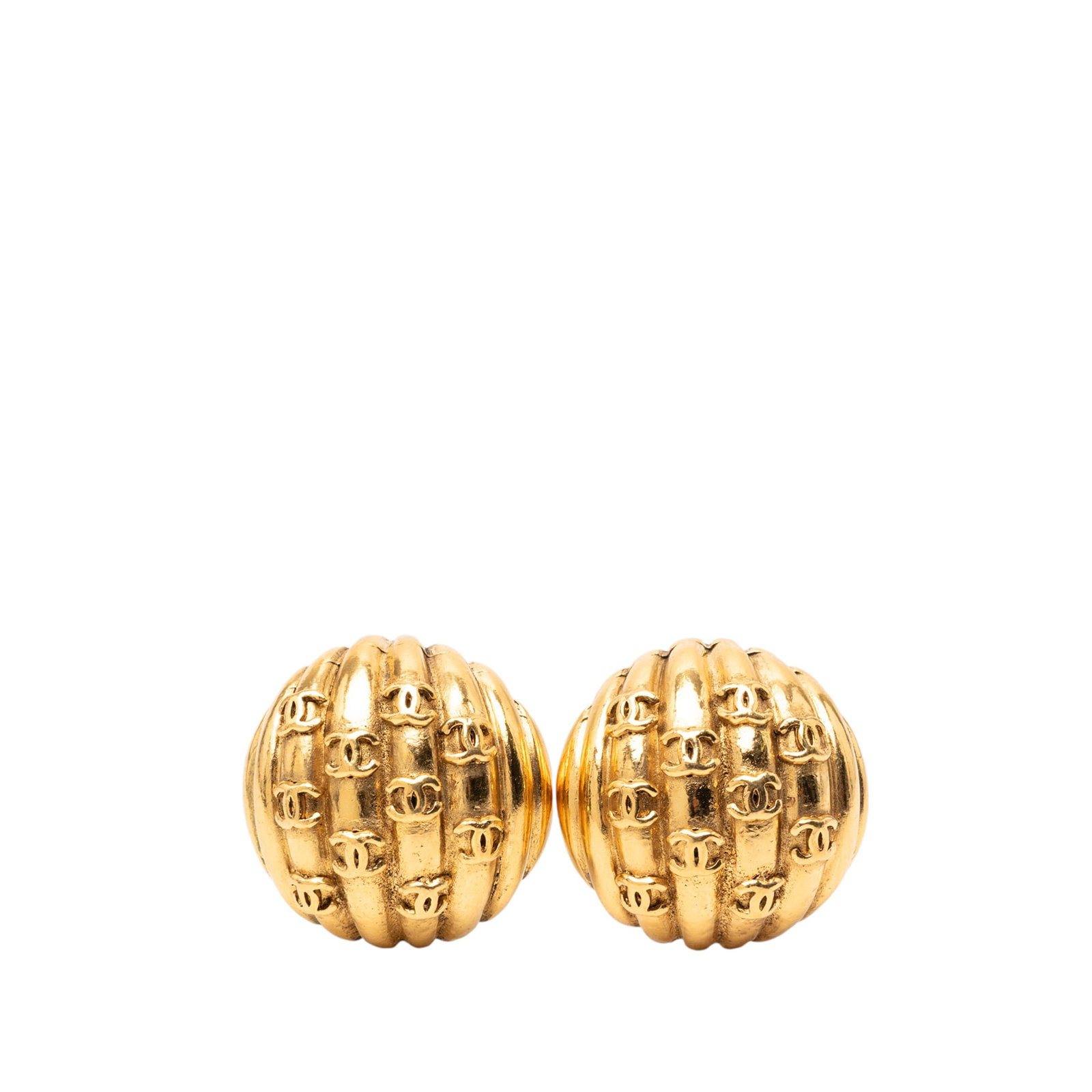 Chanel Round Gold Tone Clip Earrings with CC Motif: Chanel Round Gold Tone Clip Earrings with CC Motif These Chanel clip-on earrings feature a gold-tone metal body with iconic CC logos arranged in rows. Made in France, these round costume earrings offe