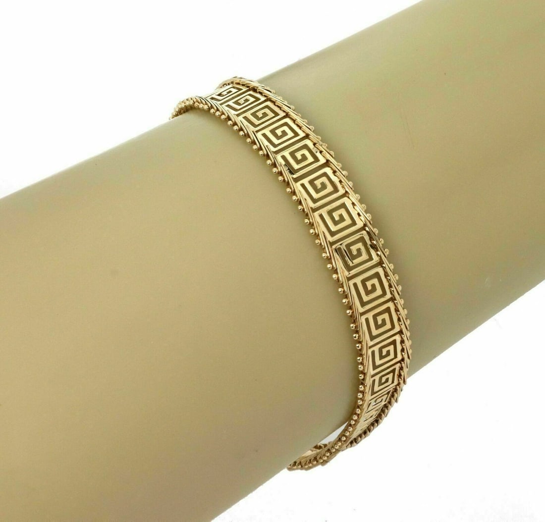 14k Yellow Gold Charm Bracelet Double Round Link 7.5 Inch: 14k Yellow Gold Charm Bracelet Double Round Link 7.5 Inch This 14k yellow gold double round link charm bracelet features interwoven 8mm wide polished links, offering both elegance and durability. The 