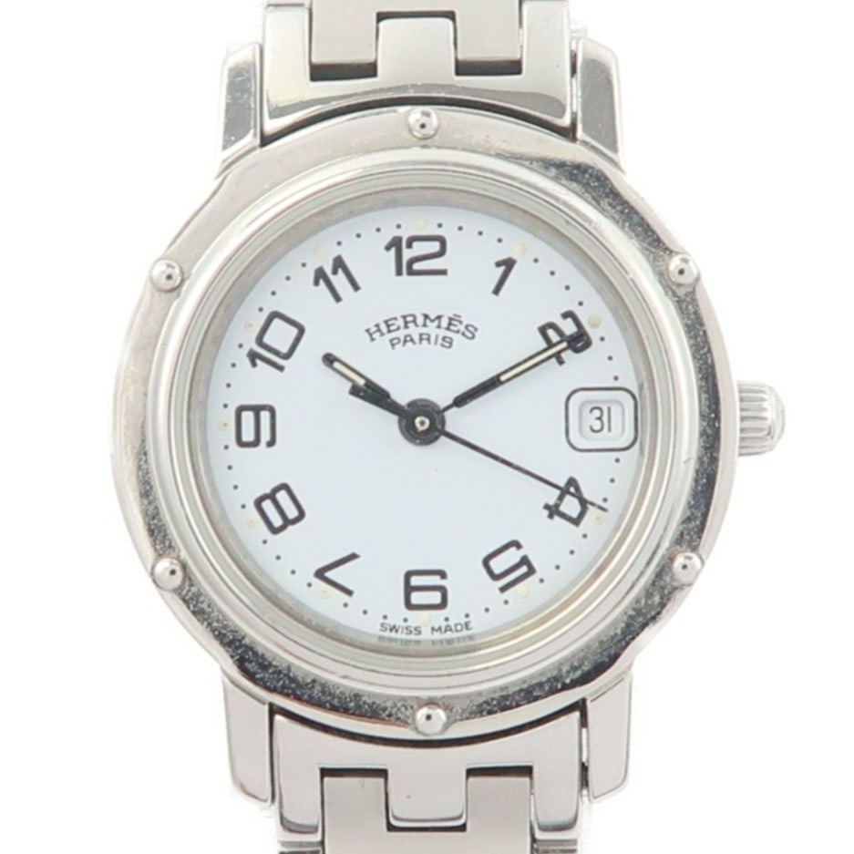 Hermes Clipper CL4.210 White Dial Quartz Steel Wristwatch: Hermes Clipper CL4.210 White Dial Quartz Steel Wristwatch This Hermes Clipper CL4.210 wristwatch features a stainless steel case and band, complemented by a white dial. Designed for women, it operates