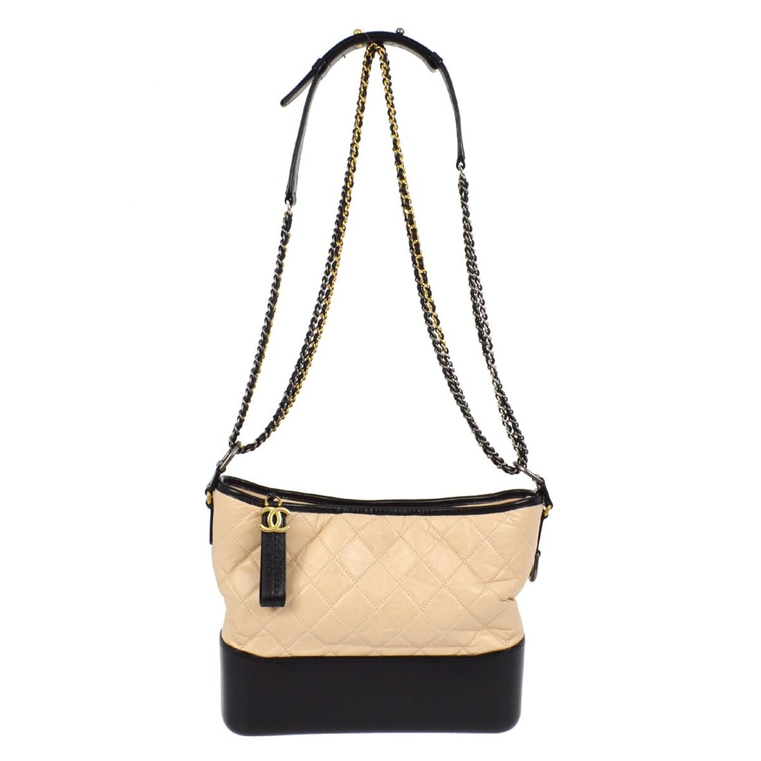 Medium Gabrielle Shoulder Bag by Chanel in Beige and Black Calfskin: Medium Gabrielle Shoulder Bag by Chanel in Beige and Black Calfskin This Chanel Gabrielle shoulder bag features a beige calfskin leather exterior with quilted accents and a black base. It is designed 