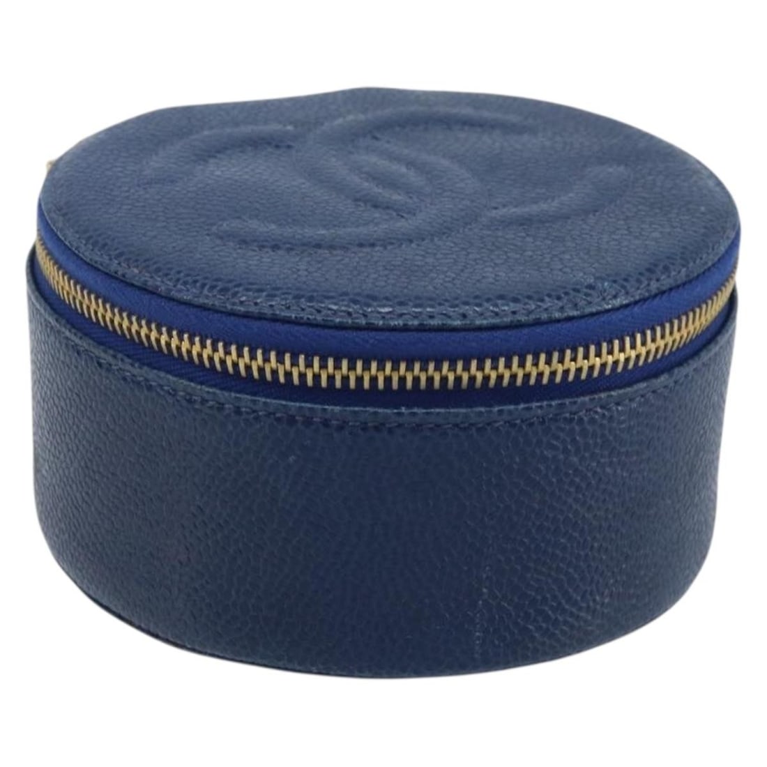 Navy Caviar Skin Cosmetic Case with Gold CC by CHANEL: Navy Caviar Skin Cosmetic Case with Gold CC by CHANEL This CHANEL cosmetic pouch is crafted from navy blue caviar skin leather with gold-tone CC detailing. Designed for women, it features a compact st