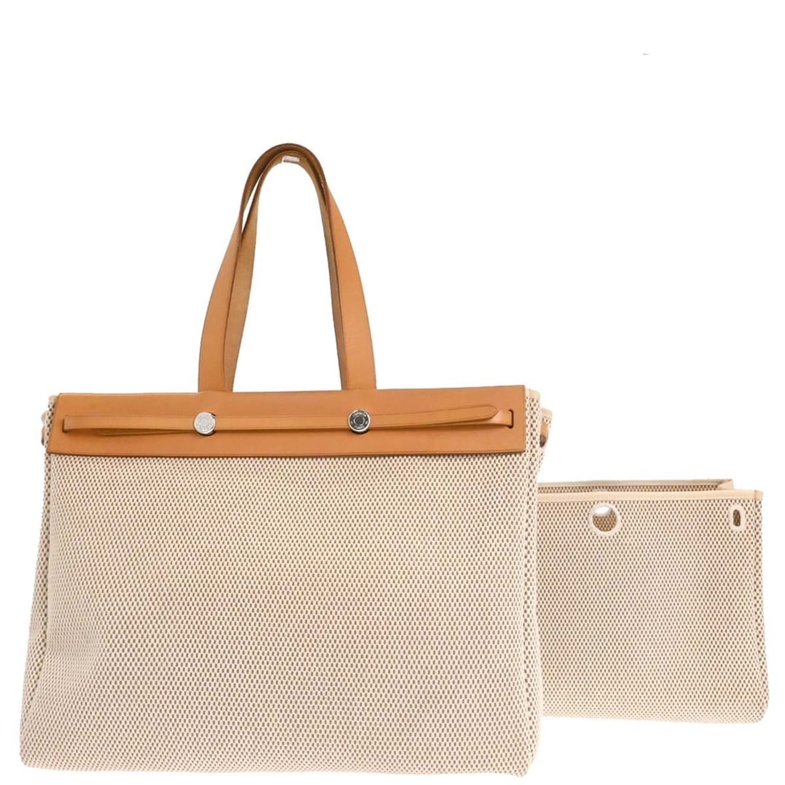 Herbag Cabas Beige Canvas and Leather Tote Bag by Hermes: Herbag Cabas Beige Canvas and Leather Tote Bag by Hermes The Hermes Herbag Cabas is a stylish tote designed for women, crafted from beige canvas with leather accents. Made in France, this bag features