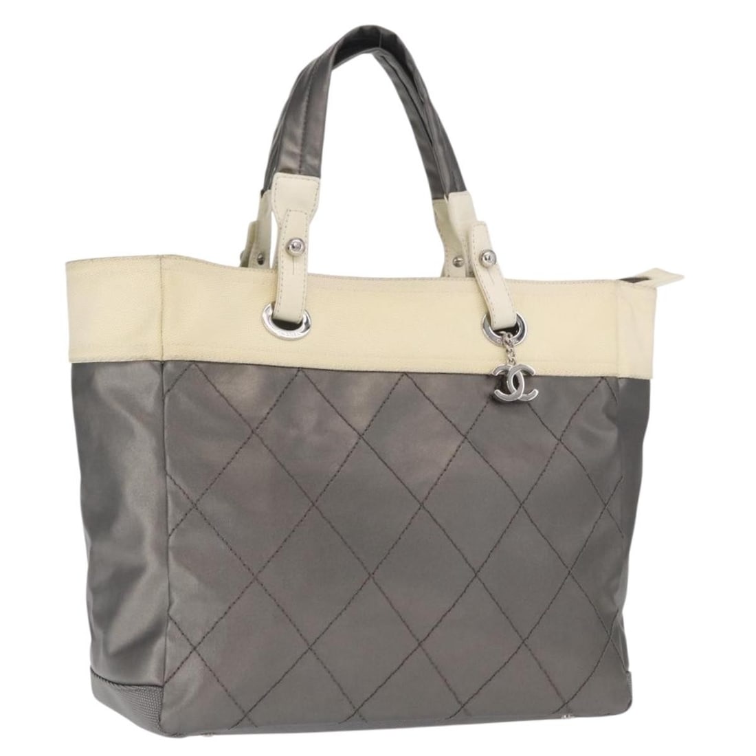 Chanel Paris Biarritz GM Silver Nylon Tote Bag Large Size: Chanel Paris Biarritz GM Silver Nylon Tote Bag Large Size This CHANEL Paris Biarritz GM Tote Bag features a silver nylon exterior with silver-tone CC detailing. Made in Italy, it offers a spacious int