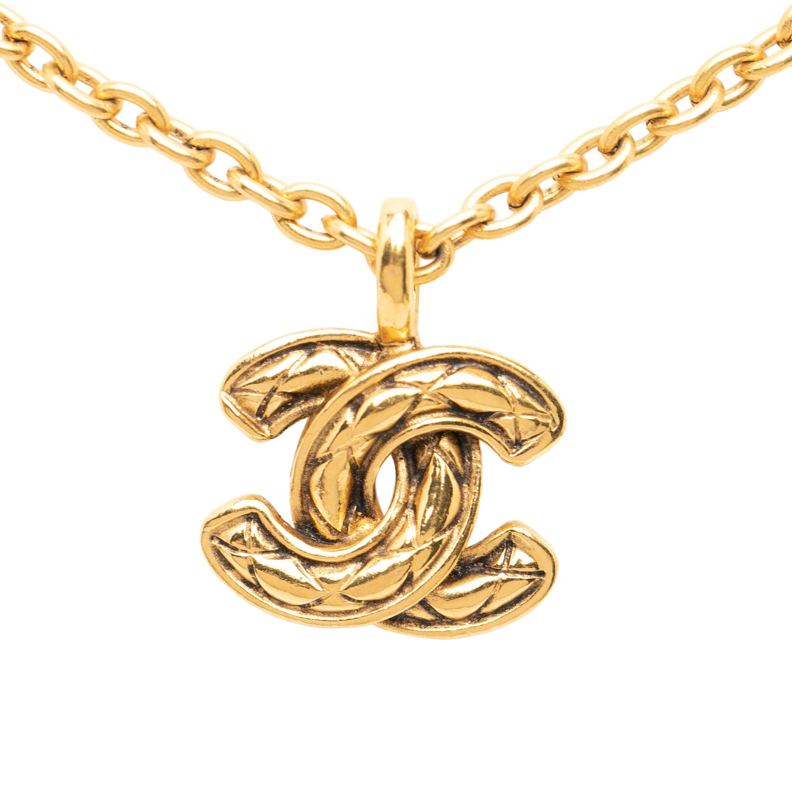 Chanel Quilted CC Pendant Gold Tone Metal Necklace: Chanel Quilted CC Pendant Gold Tone Metal Necklace This Chanel necklace showcases a gold-tone chain with a signature quilted CC pendant, secured by a spring ring closure. The piece is designed as cost