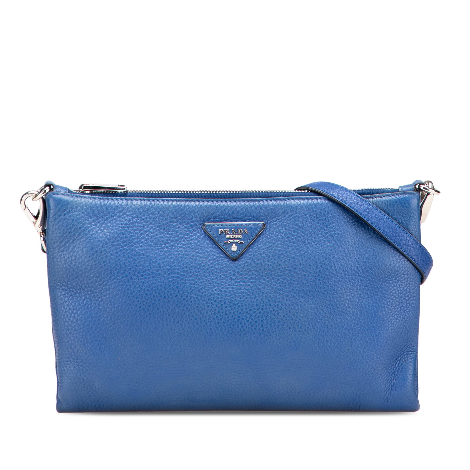Prada Vitello Daino Leather Crossbody Bag Blue Italy: Prada Vitello Daino Leather Crossbody Bag Blue Italy The Prada Vitello Daino Crossbody bag is a stylish and functional accessory made from high-quality leather. It features an adjustable flat leather 