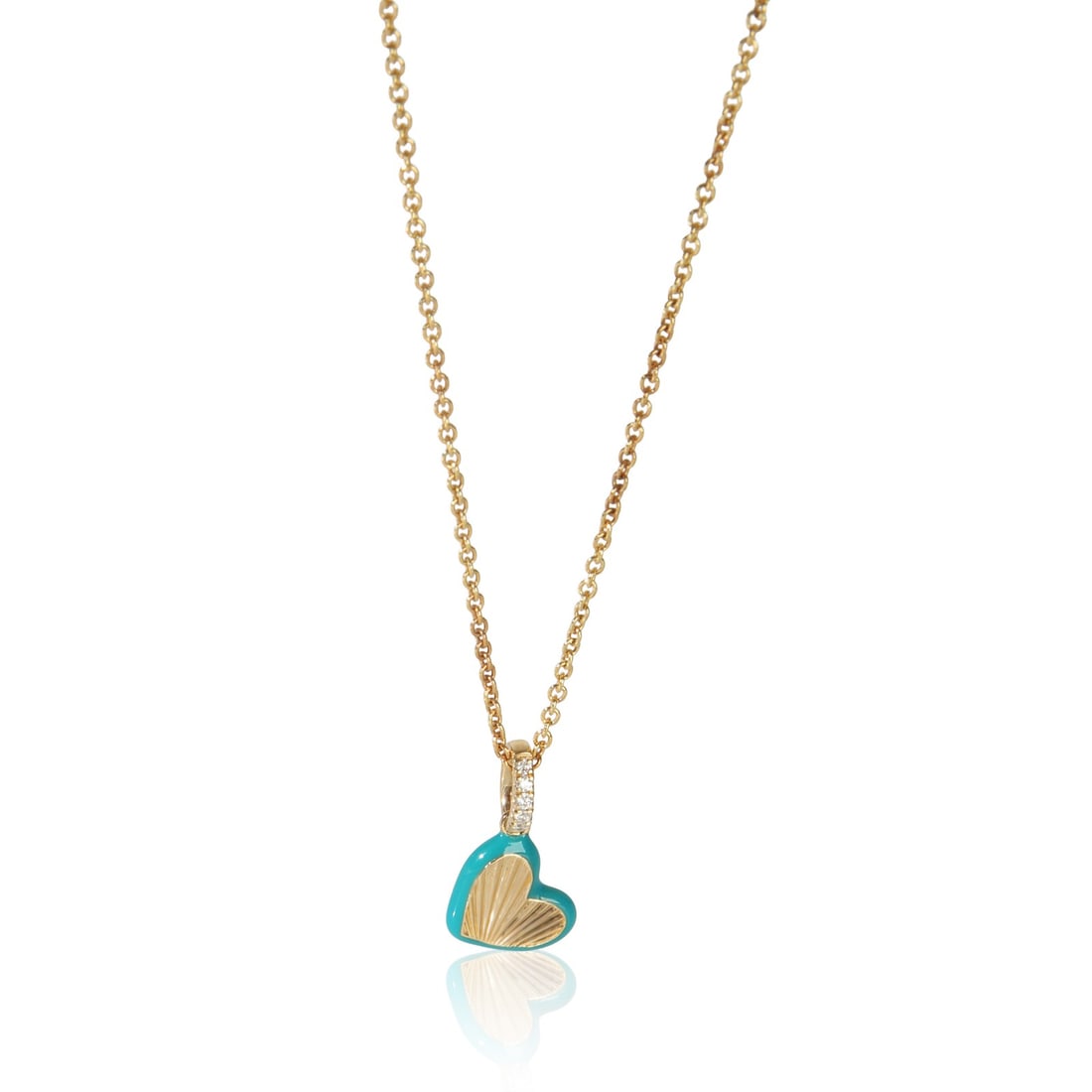 Blue Enamel Mini Heart Pendant in 14K Yellow Gold with Diamonds: Blue Enamel Mini Heart Pendant in 14K Yellow Gold with Diamonds This pre-owned pendant features a mini heart design from the Blue Enamel Mini Heart collection. Crafted in 14K yellow gold, it is adorne