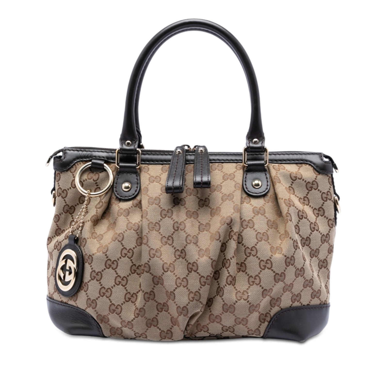 Gucci Sukey Beige Canvas Satchel with Leather Trim: Gucci Sukey Beige Canvas Satchel with Leather Trim The Gucci GG Canvas Sukey Satchel features a beige canvas body with leather trim, rolled leather handles, a top zip closure, and both interior zip an