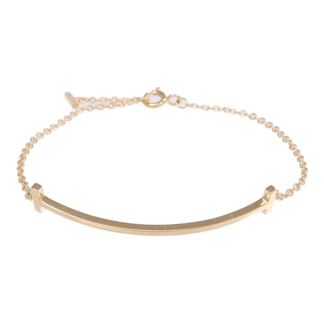 Tiffany Co T Smile K18PG Rose Gold Bracelet: Tiffany Co T Smile K18PG Rose Gold Bracelet This Tiffany & Co. T Smile bracelet is crafted from 18K rose gold and features a sleek, modern design. Made for women, it showcases the signature T motif in