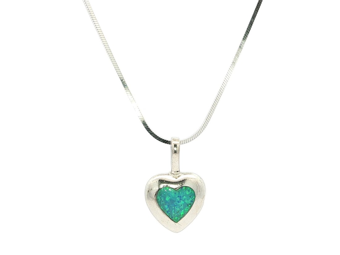 Sterling Silver Heart Pendant with Natural Boulder Opal Necklace: Sterling Silver Heart Pendant with Natural Boulder Opal Necklace This stunning pendant features a natural genuine Boulder Opal in a custom heart shape, displaying a captivating blue base with vibrant 