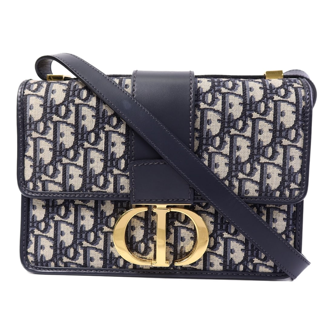 Dior Montaigne 30 Blue Canvas Shoulder Bag GHW: Dior Montaigne 30 Blue Canvas Shoulder Bag GHW This Christian Dior Montaigne 30 shoulder bag features a blue canvas exterior and is designed for women. The bag has a structured silhouette with gold-to